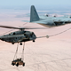 Illustration for article titled This Is A Plane Thats Refueling A Helicopter Thats Carrying A Hummer